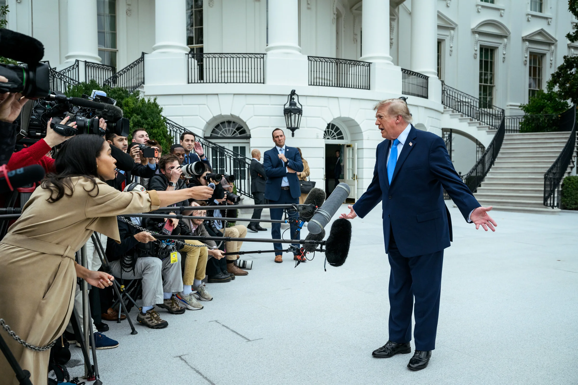 President Donald J. Trump speaks with members of the media on the South Lawn before boarding Marine One en route to Joint Base Andrews, Saturday, October 3, 2026. (Official White House Photo by Joyce N. Boghosian)